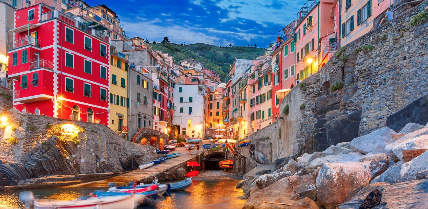 Riomaggiore fishing village during evening twilight blue hour, seascape in Five lands, Cinque Terre National Park, Liguria, Italy. — Photo by olgacov