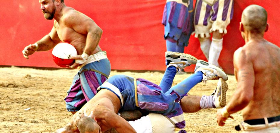 Fighting players during Calcio Fiorentino match. Calcio fiorentino (calcio storico or calcio in costume) is an historic florentine game, origins of modern football— Photo by Malgorzata_Kistryn