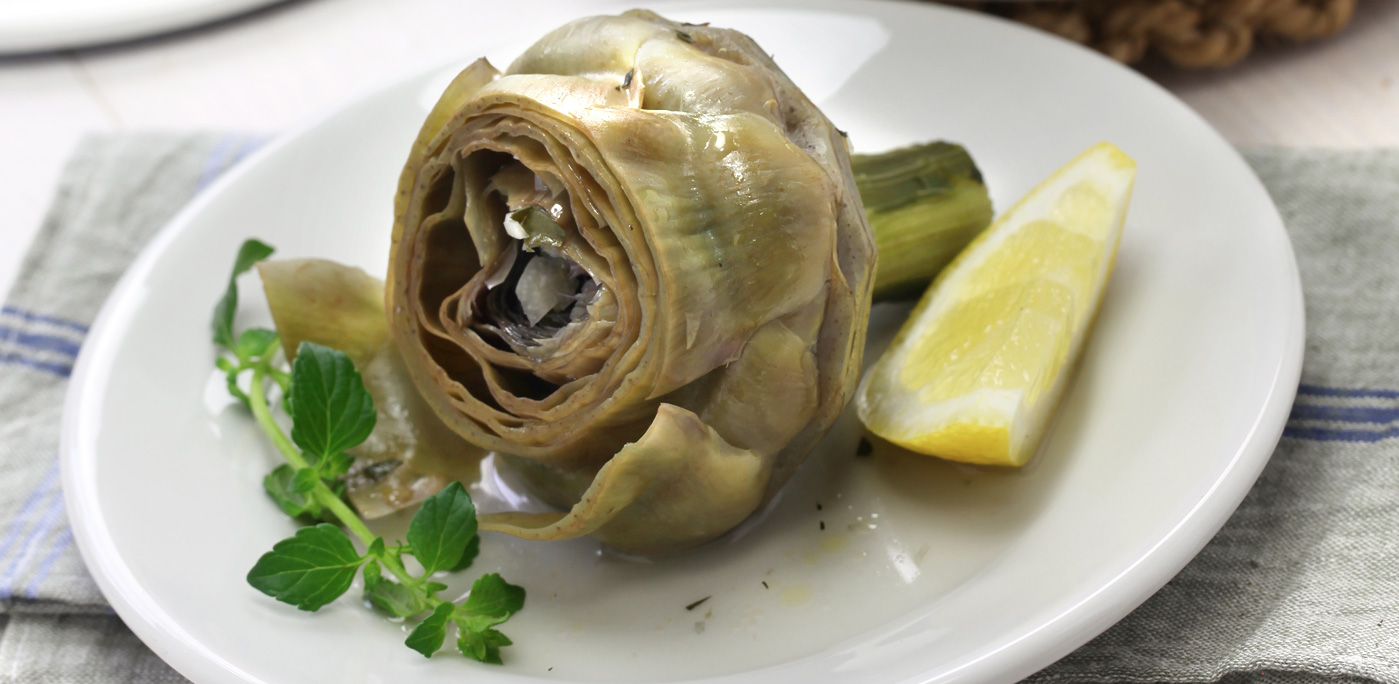 Carciofi alla Romana, Roman style boiled artichokes. Photo by asimojet