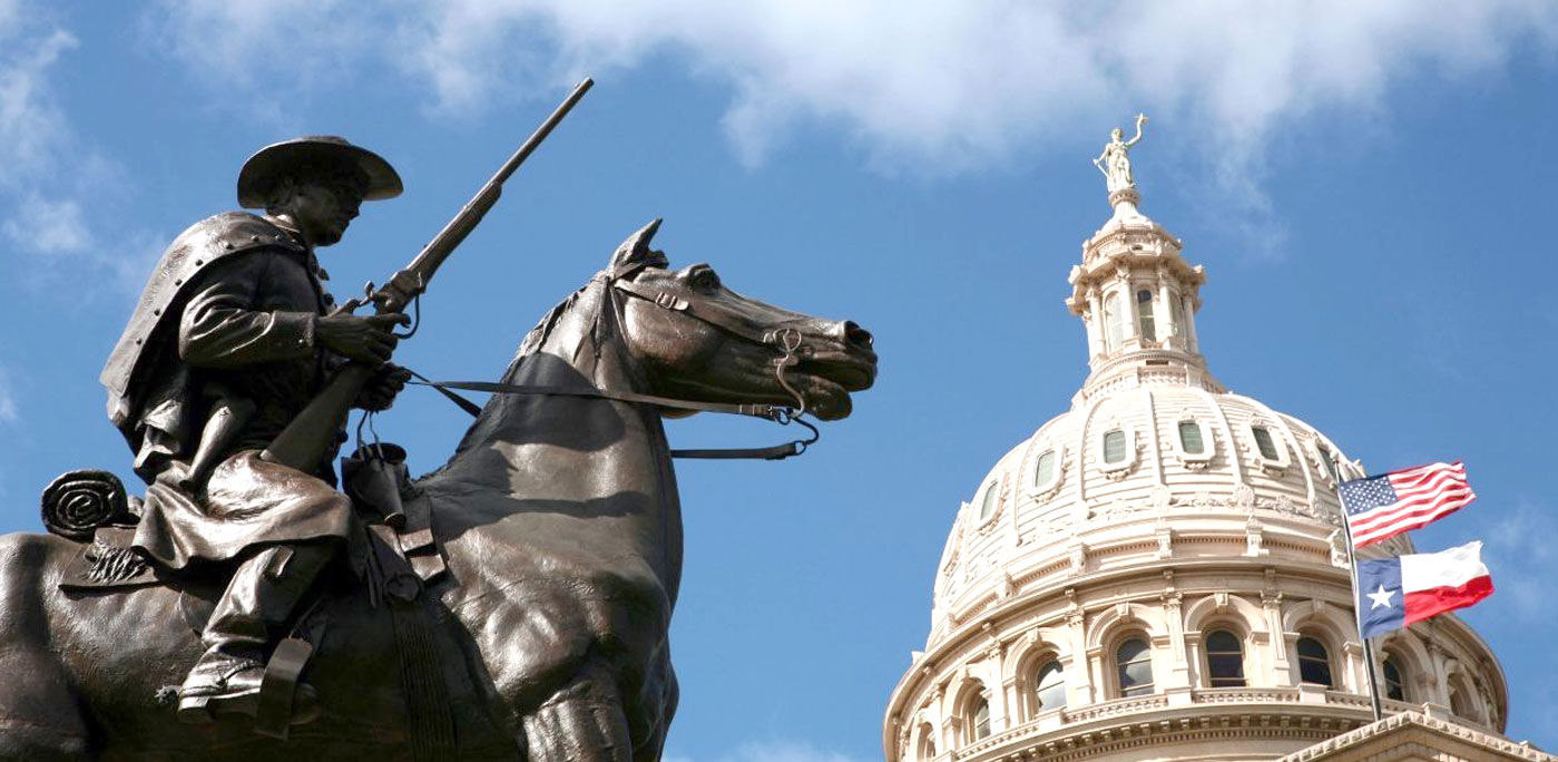 A bronze statue of a horse and rider faces the imposing Texas State Capitol Building in Austin, Texas. Photo credit: Marianna Day Massey/ZUMA Press/Newscom