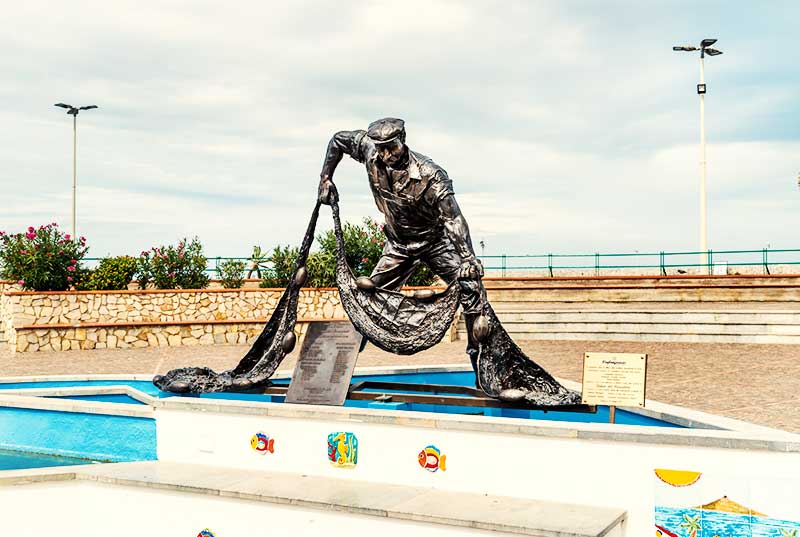 Statue of the Fisherman on the Pittsburg square in the center of Island of Women, Sicily