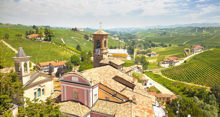 The town of Barolo among rolling hills with vineyards in Piedmont, Italy.— Photo by olgysha