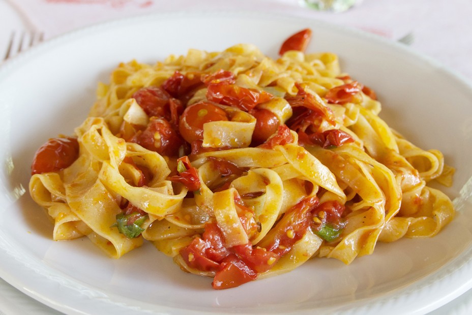 Hand-made tagliatelle with “pomodori scoppiati,” exploding tomatoes, at Le Comari di Farfa, Castelnuovo di Farfa. | Credit: Copyright Nathan Hoyt/Forktales