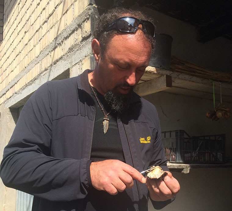 Our guide, Luciano, shaves a mushroom, picked freshly from the ground (Amandola)