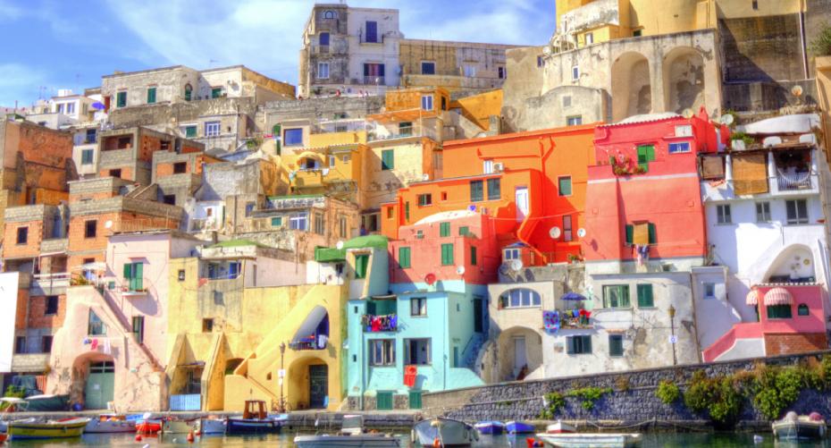 Procida, beautiful and colorful island in the Mediterranean sea, near Naples, italy. View of La Corricella harbour.— Photo by ronnybas