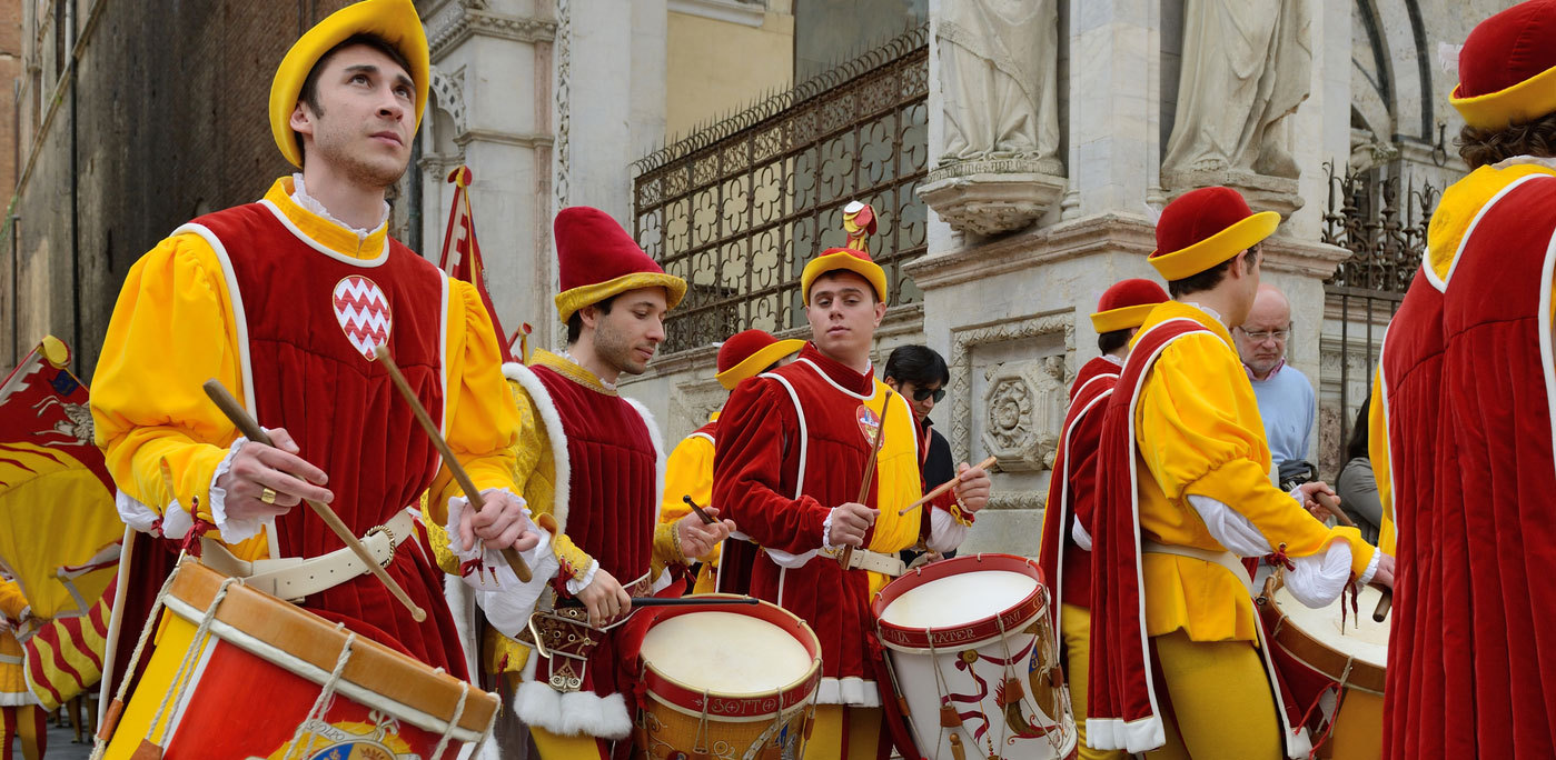 The contrada of Valdimontone (Valley of the Ram) parade through the streets of Siena in preparation for the Palio April 28, 2013 in Siena, Italy. — Photo by _fla