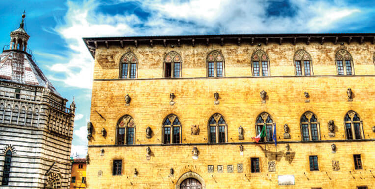 San Giovanni in Corte baptistery and Palazzo Pretorio in Pistoia, Italy— Photo by AlKan32