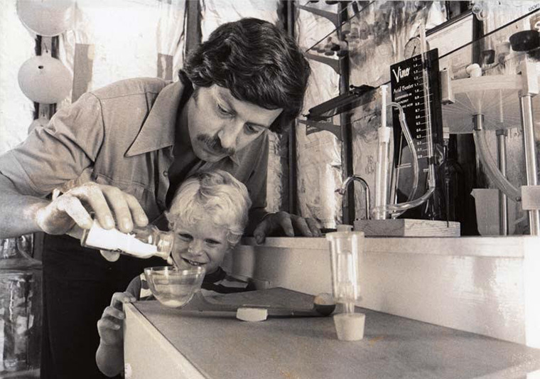 Inspired by his Italian grandparents, Gary Figgins planted his first vineyard in 1974. In this 1979 photo with son Chris, now president of Leonetti Cellar, Figgins shares an early lesson about winemaking. (Leonetti Cellar)